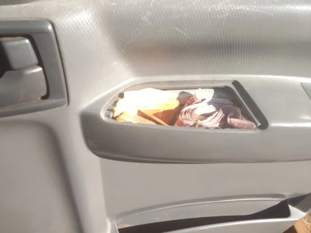 The roof lining of the cab opened to show the concealment space behind it