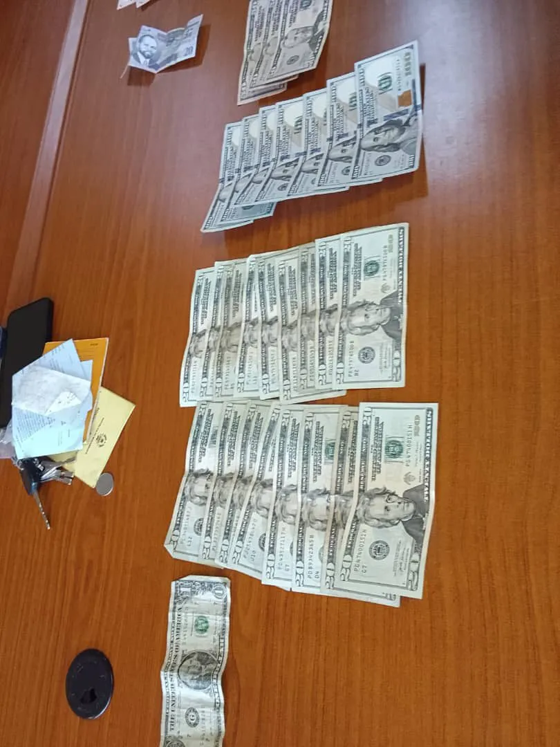 US dollar notes and the bag they were carried in