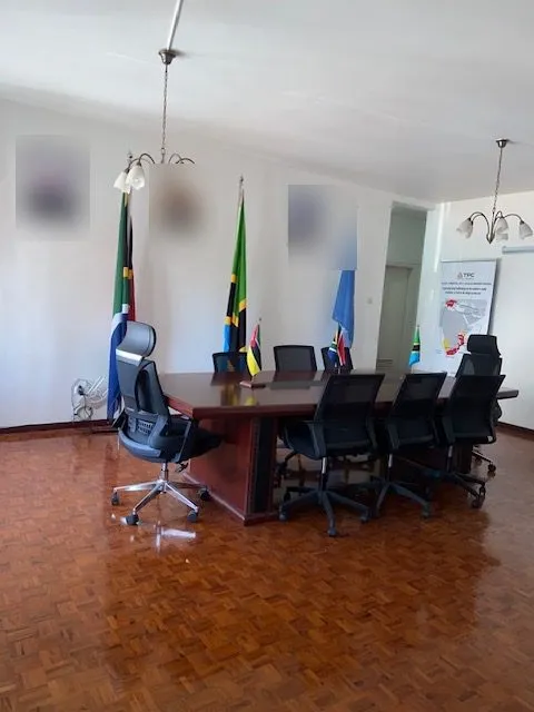The TPC boardroom, Maputo: conference table with the flags of South Africa, Tanzania, Mozambique and the United Nations